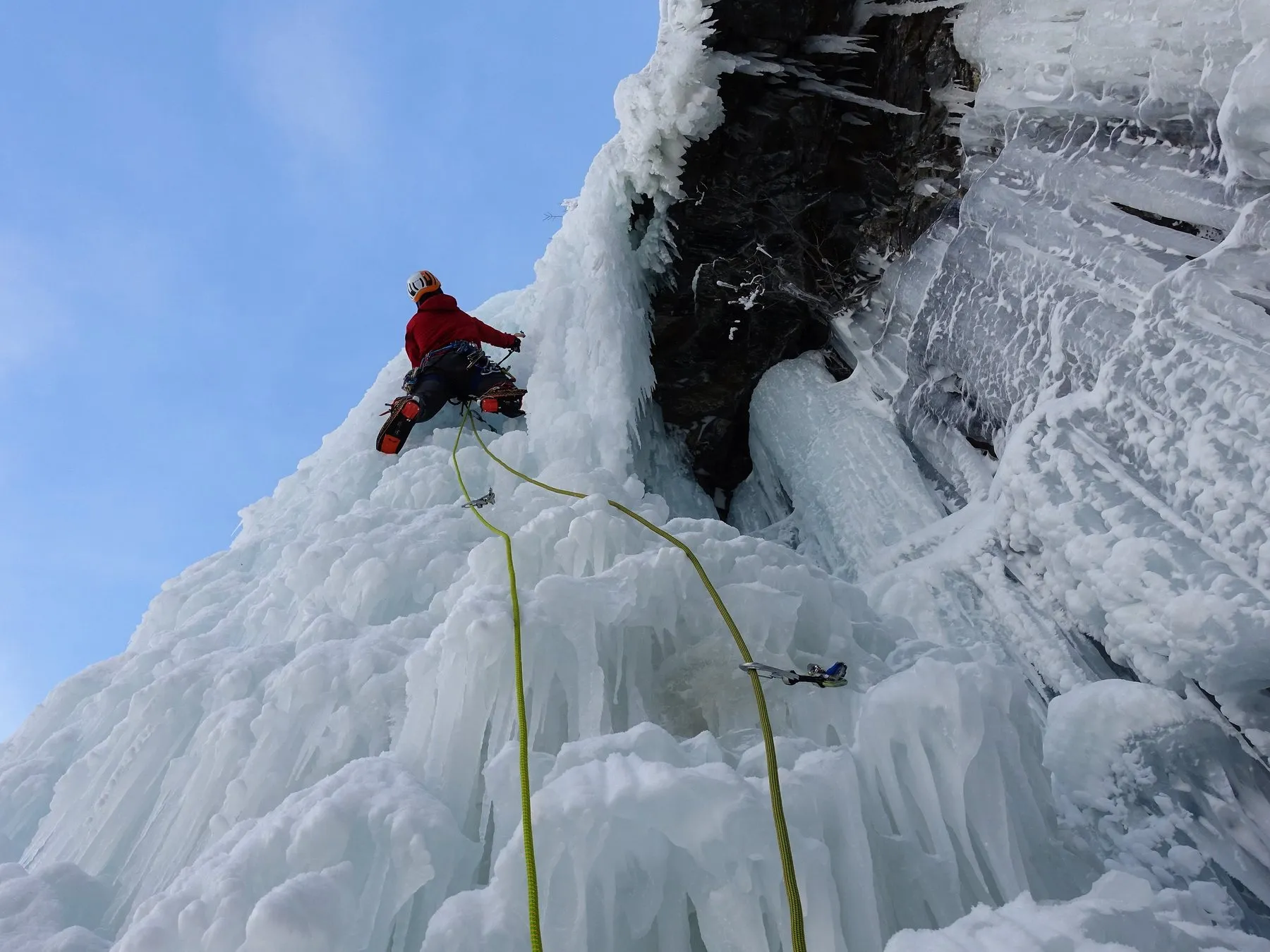 Alastair leading a steep frozen waterfall pitch